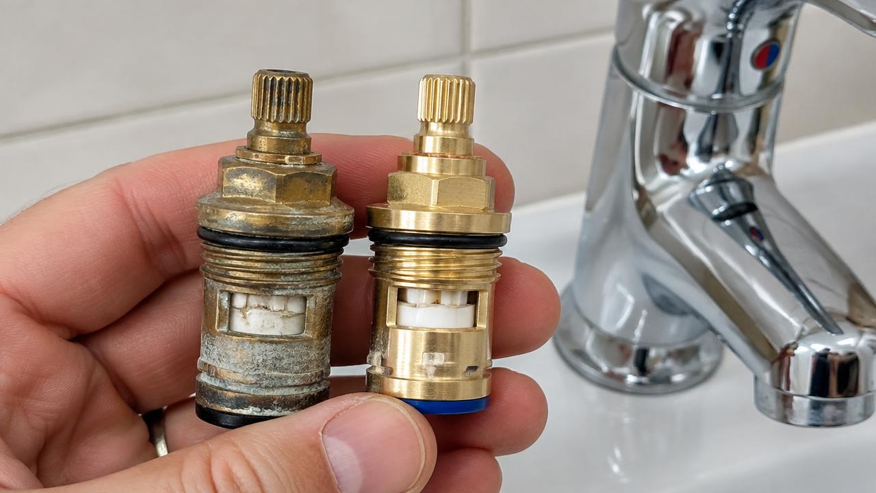 Ceramic disc cartridge being removed from a mixer tap